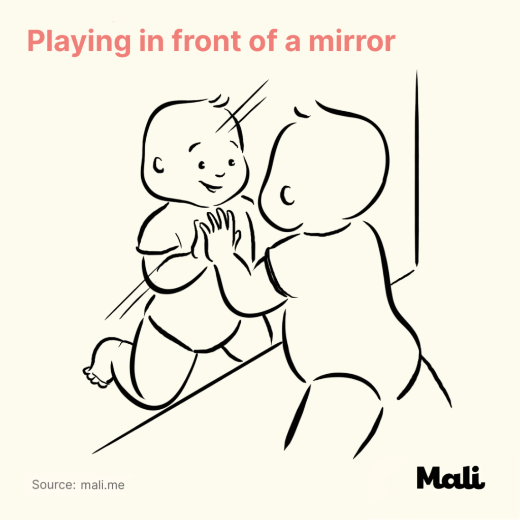 Playing in front of a mirror Five Ways to Encourage Crawling by Mali