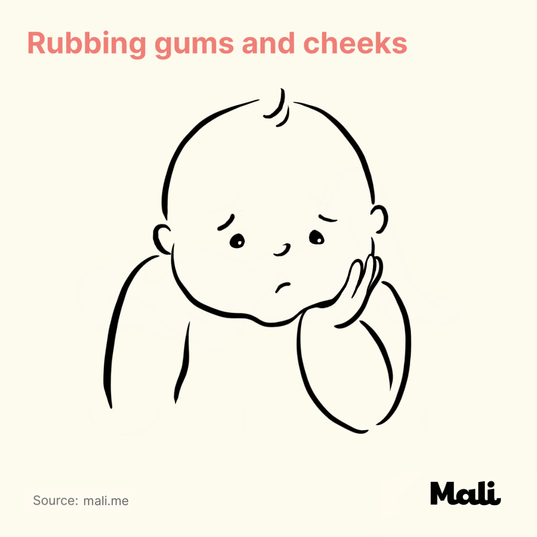 Rubbing gums and cheeks_6 ways to determine whether your baby is sick or teething? by Mali